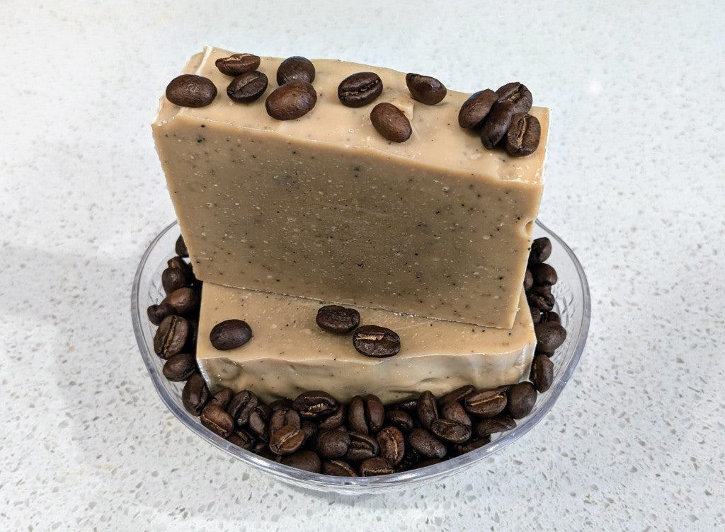 Coffee soap bars in a bowl of coffee beans