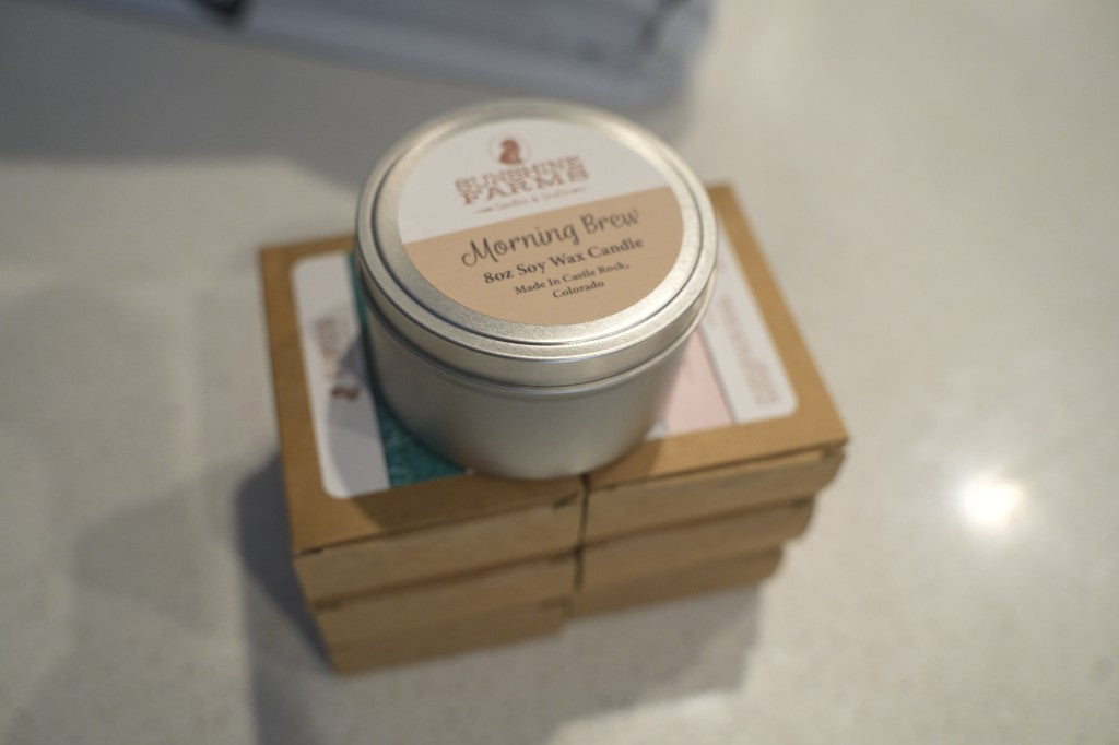 Morning brew soy candle stacked on kraft boxes